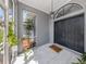 The entryway is tiled with black double doors and a 'Home Sweet Home' welcome mat at 4070 Kincord Ln, North Port, FL 34287
