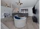 Open living area with vaulted ceilings, large sectional, and view of the kitchen at 4070 Kincord Ln, North Port, FL 34287