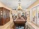 Grand dining room featuring a long wooden table, elegant decor, and plenty of space at 416 Baycrest Dr, Venice, FL 34285