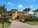 Mediterranean style home with brick driveway, lush landscaping and blue skies at 416 Baycrest Dr, Venice, FL 34285