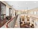 Open floor plan with view of the lower level living area, display cabinets, and decorative furniture at 416 Baycrest Dr, Venice, FL 34285