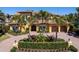 Charming two-story home featuring a brick driveway, lush landscaping, and an inviting front entrance at 416 Baycrest Dr, Venice, FL 34285