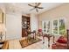 Bright home office featuring custom shelving, classic furniture, and large windows offering a pleasant workspace at 416 Baycrest Dr, Venice, FL 34285