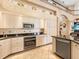 Gourmet kitchen with stainless steel appliances, custom cabinets, and a modern design at 416 Baycrest Dr, Venice, FL 34285