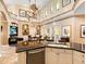 Gourmet kitchen with an island and breakfast bar overlooking the living room, creating an open-concept living space at 416 Baycrest Dr, Venice, FL 34285