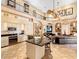 Open-concept kitchen and living room with stainless appliances and ample seating at 416 Baycrest Dr, Venice, FL 34285
