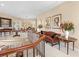 Open upstairs landing with decorative painting and elegant furniture with railings overlooking downstairs area at 416 Baycrest Dr, Venice, FL 34285