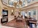 Spacious living room with large windows, two sofas, and decor at 416 Baycrest Dr, Venice, FL 34285