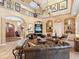 Elegant living room featuring an open layout, tile flooring, staircase and comfortable seating with great decor at 416 Baycrest Dr, Venice, FL 34285