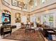 Comfortable living room with stylish seating, built-in shelving, and bright windows creating a cozy atmosphere at 416 Baycrest Dr, Venice, FL 34285