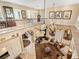 Spacious living room with tile flooring, comfortable seating, and a unique ceiling fan at 416 Baycrest Dr, Venice, FL 34285