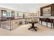 A spacious loft area with a display cabinet and railing at 416 Baycrest Dr, Venice, FL 34285