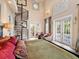 Spacious main bedroom with a spiral staircase, white tile floors, and access to the patio at 416 Baycrest Dr, Venice, FL 34285
