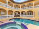 Courtyard pool with a built-in spa and multiple balconies with white railings at 416 Baycrest Dr, Venice, FL 34285