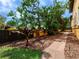 Landscaped yard showcasing lush plants, a brick pathway, and a well-maintained garden area at 416 Baycrest Dr, Venice, FL 34285