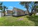 View of a well maintained yard with a shed on the side of the house at 419 Shore Rd, Nokomis, FL 34275