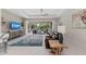 Bright living room featuring tile floors, a ceiling fan, and sliding glass doors to the outdoor patio at 419 Shore Rd, Nokomis, FL 34275