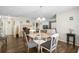Cozy dining area features a glass table with seating for four, with open access to other rooms at 4437 Tippecanoe Trl # 6, Sarasota, FL 34233