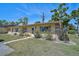 Inviting exterior showcasing the home's facade, green lawn, and pleasant landscaping at 4437 Tippecanoe Trl # 6, Sarasota, FL 34233