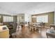 Spacious living and dining area featuring updated flooring, comfortable seating, and natural light at 4437 Tippecanoe Trl # 6, Sarasota, FL 34233