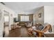 Comfortable living room with ceiling fan, wood floors, and sliding glass doors for plenty of light at 4437 Tippecanoe Trl # 6, Sarasota, FL 34233