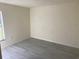 An empty bedroom featuring light gray flooring at 4595 Horseshoe Ave, North Port, FL 34286