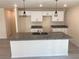 Modern kitchen with granite countertop island, sleek cabinets, and stylish pendant lighting at 4595 Horseshoe Ave, North Port, FL 34286