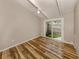 Bright bedroom with a ceiling fan, neutral walls, and glass sliding door to patio at 500 N Jefferson Ave # A3, Sarasota, FL 34237