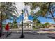 Elegant white church with a tall steeple, framed by trees against a blue sky at 500 N Jefferson Ave # A3, Sarasota, FL 34237