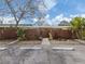 Exterior of this home featuring a wood fence, tropical landscaping and a private front yard at 500 N Jefferson Ave # A3, Sarasota, FL 34237