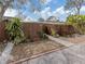 Charming home featuring a private front yard with wood fence and lush tropical landscaping at 500 N Jefferson Ave # A3, Sarasota, FL 34237