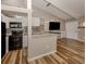 Modern kitchen features granite countertops, an eat-in bar, and wood floors at 500 N Jefferson Ave # A3, Sarasota, FL 34237