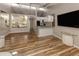 Bright living room with wood flooring, sleek modern furnishings, vaulted ceilings, and an open layout at 500 N Jefferson Ave # A3, Sarasota, FL 34237