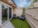 Private outdoor patio area with chairs and artificial grass at 500 N Jefferson Ave # A3, Sarasota, FL 34237