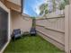 Enclosed patio area with outdoor seating and artificial grass at 500 N Jefferson Ave # A3, Sarasota, FL 34237