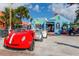 Charming street with colorful shops and unique rental cars under a blue sky at 500 N Jefferson Ave # A3, Sarasota, FL 34237