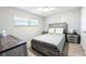 Cozy bedroom with stylish furniture, natural light, and serene ambiance for rest and relaxation at 512 W Venice Ave # 102, Venice, FL 34285