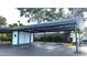 Exterior of carport parking, providing covered parking spaces for tenants at 512 W Venice Ave # 102, Venice, FL 34285