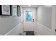 Welcoming entryway features a decorative glass door and neutral wall color that provides a warm ambiance at 512 W Venice Ave # 102, Venice, FL 34285