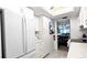 Bright white kitchen featuring modern appliances, ample cabinet space, and an inviting open layout at 512 W Venice Ave # 102, Venice, FL 34285