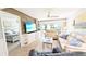 Inviting living room with a beach house theme, comfortable seating, and view of the screened lanai at 512 W Venice Ave # 102, Venice, FL 34285
