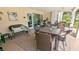 Spacious outdoor patio with comfortable seating and dining area, perfect for entertaining or relaxing in style at 512 W Venice Ave # 102, Venice, FL 34285