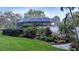 Spacious screened-in pool surrounded by beautiful landscaping, offering a private oasis at 512 W Venice Ave # 102, Venice, FL 34285