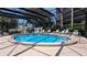 Community pool features a spacious deck with lounge chairs, surrounded by lush landscaping for a resort-like experience at 512 W Venice Ave # 102, Venice, FL 34285