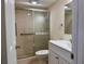 Bathroom featuring a glass-enclosed shower, vanity, and grab bar at 519 Albee Farm Rd # 116, Venice, FL 34285