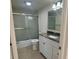 Bathroom featuring a shower/tub combination and vanity with granite countertop at 519 Albee Farm Rd # 116, Venice, FL 34285