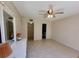 Bedroom featuring tile floors, ceiling fan, and access to a closet and bathroom at 519 Albee Farm Rd # 116, Venice, FL 34285