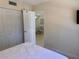 Bedroom view featuring a closet and a glimpse into the living area at 519 Albee Farm Rd # 116, Venice, FL 34285