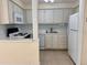 Well-lit kitchen features a full suite of appliances at 519 Albee Farm Rd # 116, Venice, FL 34285
