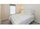 Inviting bedroom with soft natural light, a cozy bed, and stylish window treatments offers a peaceful retreat at 6037 Shearwater Dr, Englewood, FL 34224